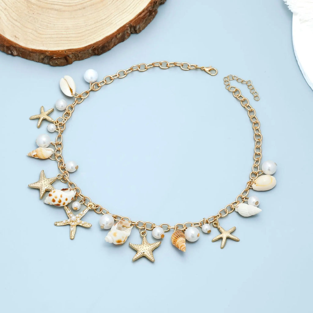 Bohemian style gold color waist chain with seashell and starfish pendant,faux pearl body chain, beach party fashion accessory.